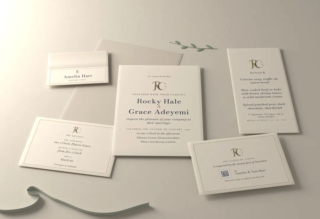 The cipher wedding stationery suite, photographed: invitation, reply card, details card, place card and menu