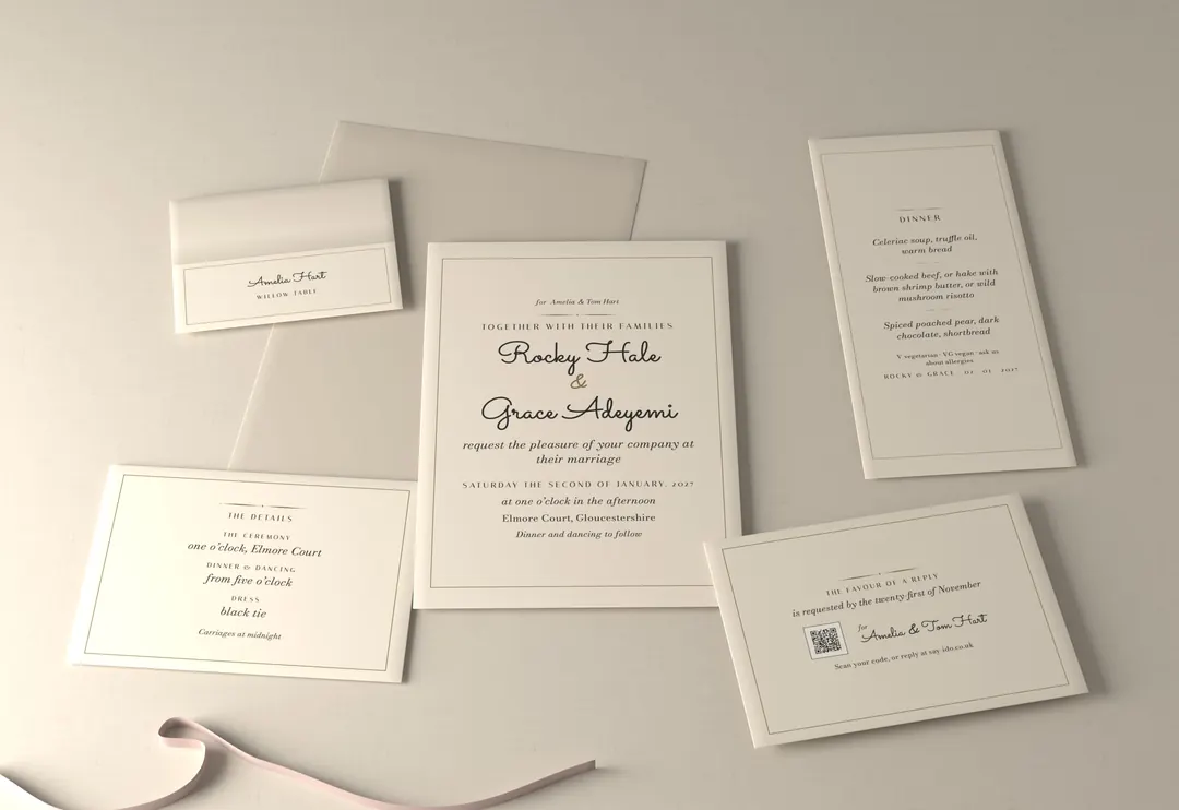 The Gilt line wedding stationery suite on ivory card with a gold hairline: invitation, reply card, details card, place card and menu